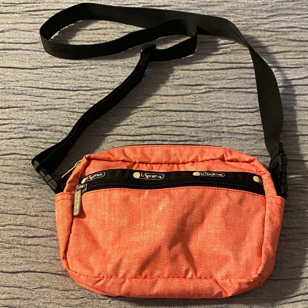 Stylish Red LESPORTSAC Crossbody Bag with adjustable strap